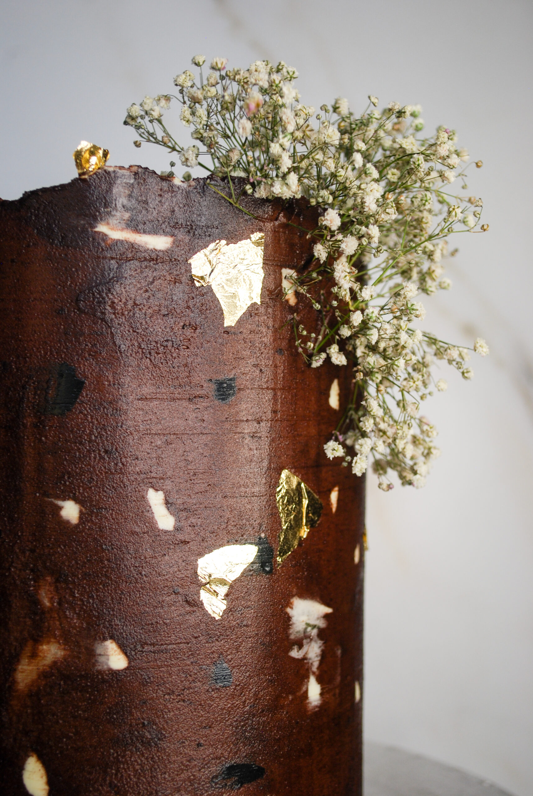 Custom cake that resembles a Terrazzo tile with babies breath flowers